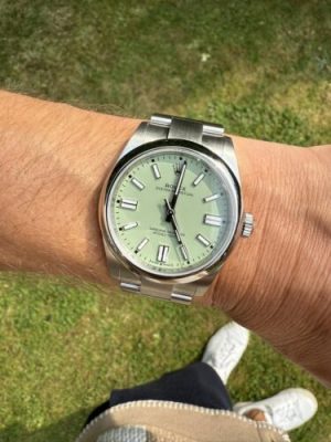Replica Rolex Oyster Perpetual Lady 31mm Coral Red Dial 277200 photo review